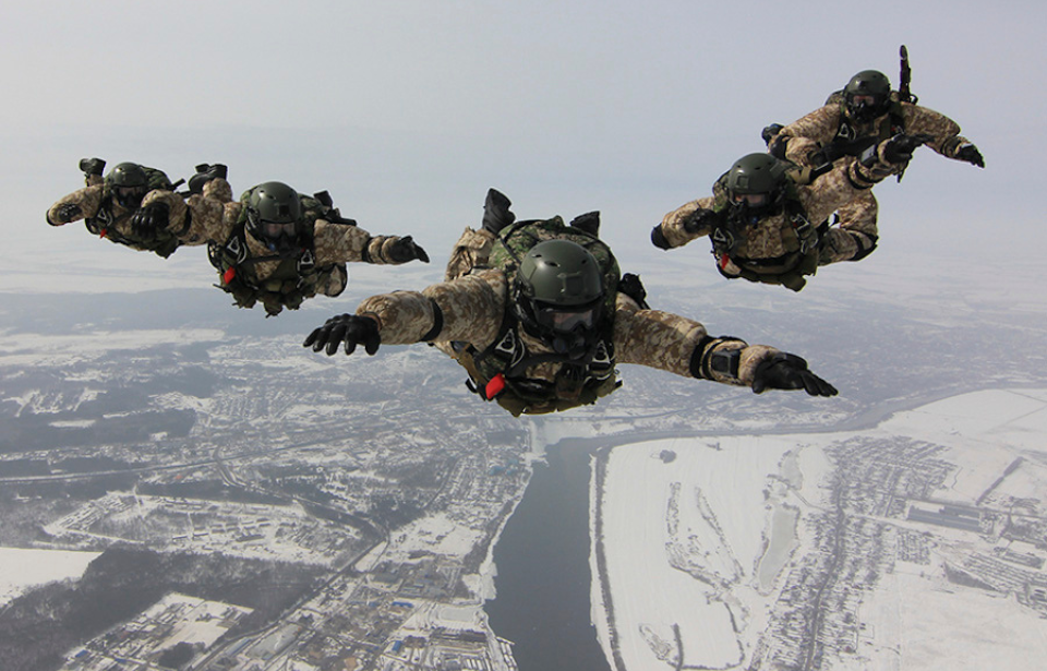 Five Russian Spetsnaz jumping from an aircraft