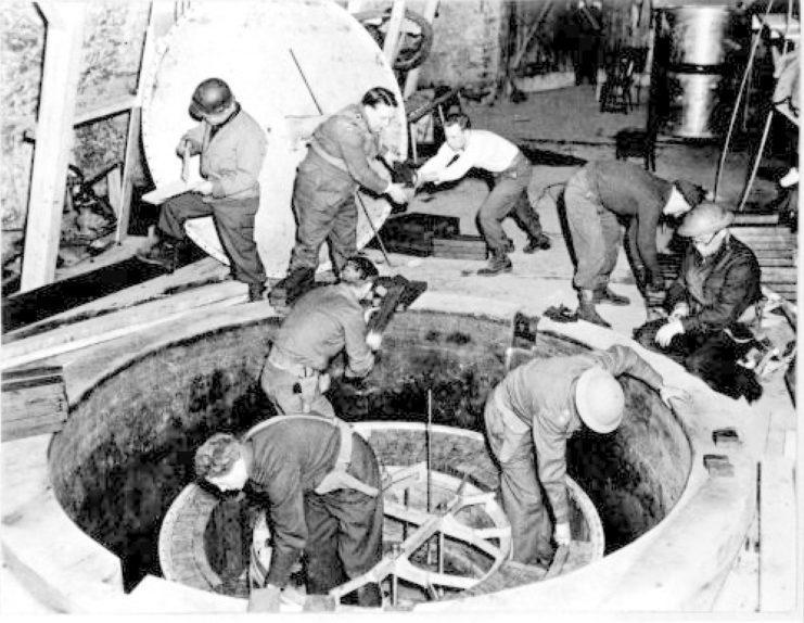Group of men dismantling the German Experimental Nuclear Pile