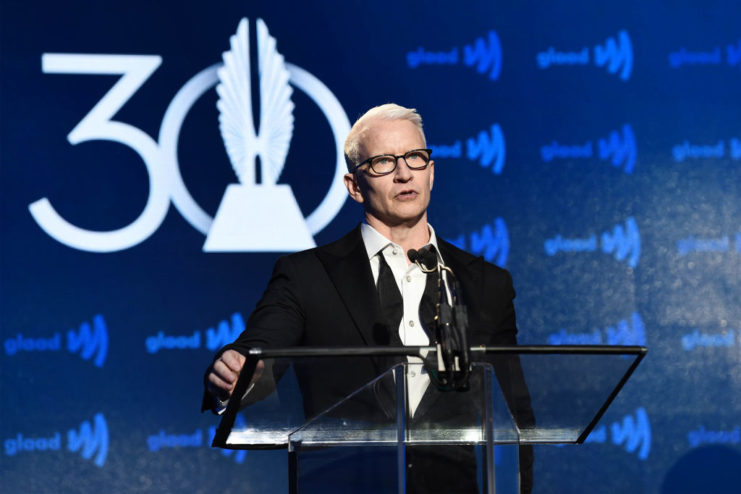 Anderson Cooper speaking at a podium