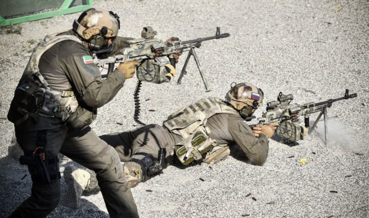 Two Chechen special forces troopers aiming their firearms
