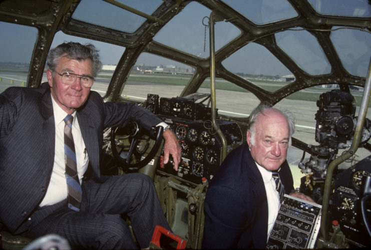 Paul Tibbets and Tom Ferebee sitting in the cockpit of the Enola Gay