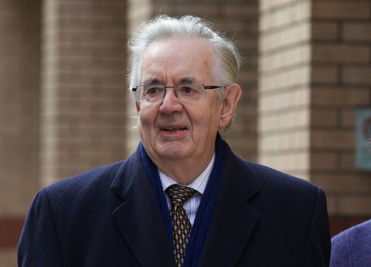 Thayne Forbes standing outside a brick building