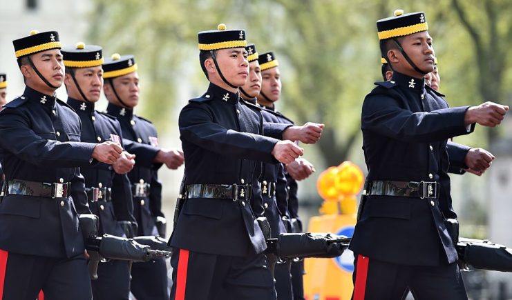 Gurkhas marching together in uniform