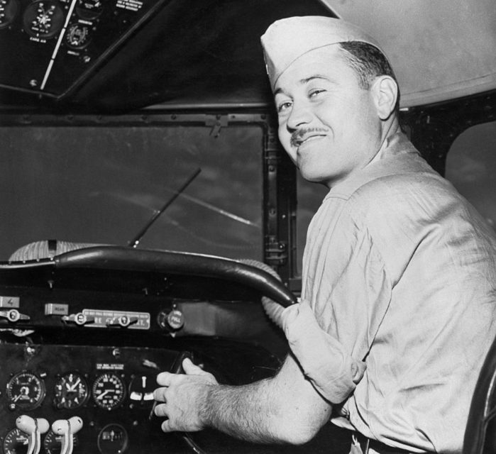 Gregory "Pappy" Boyington sitting in the cockpit of an aircraft