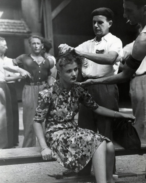 Woman having her head shaved by a man