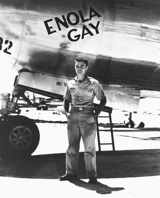 Paul Tibbets standing in front of the Enola Gay