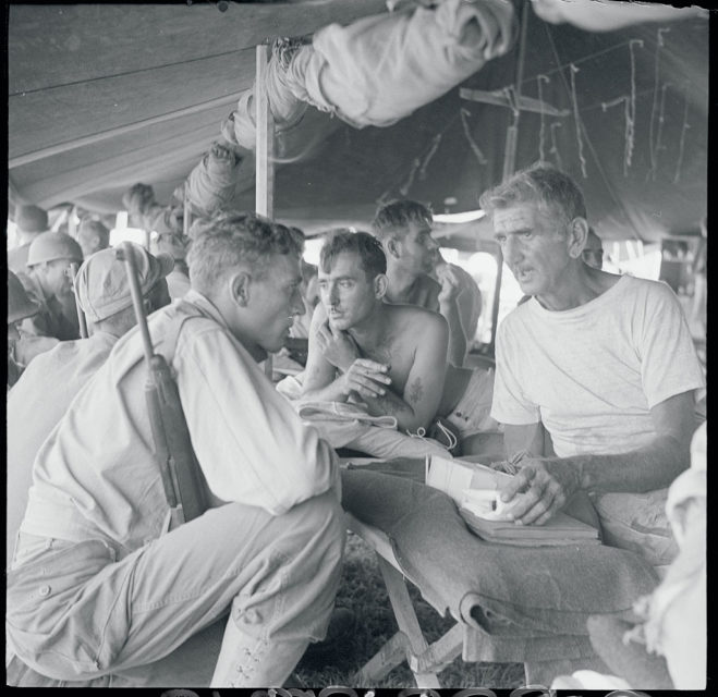 Pvt. Virgil Greeneway, William Fassoth and Pvt. First Class Lloyd Hitchens sitting together