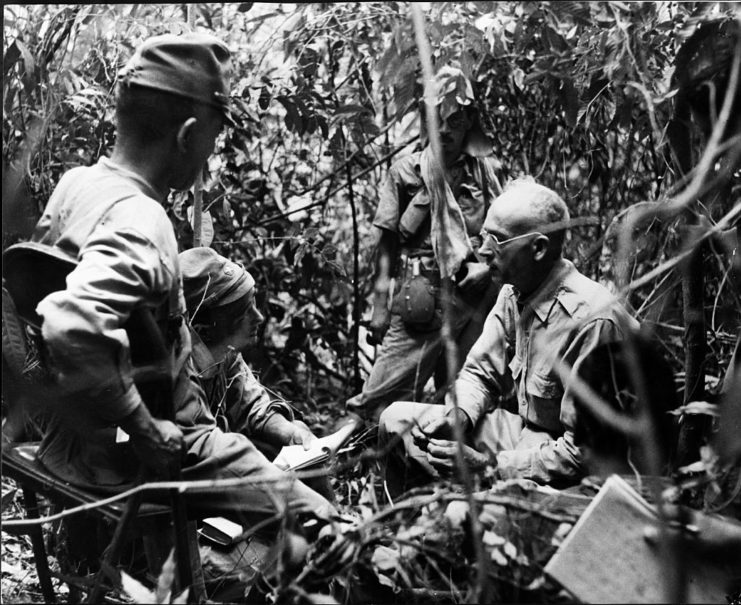 Col. Hugh Straughn being questioned by Japanese soldiers in the jungle