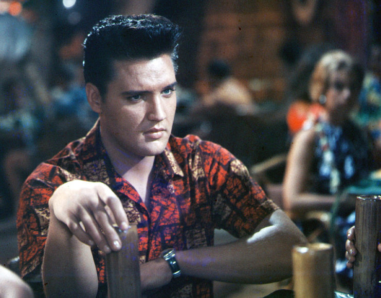 Elvis Presley sitting at a bar