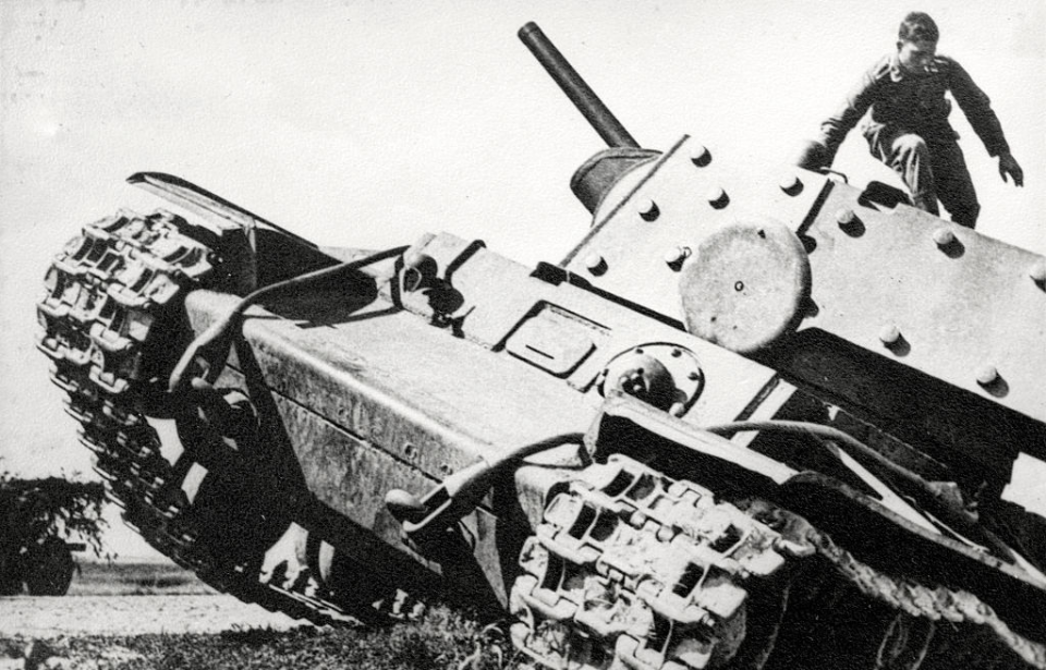 Soldier climbing out of a tank