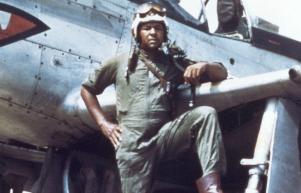 Daniel James Jr. standing next to his North American F-51 Mustang