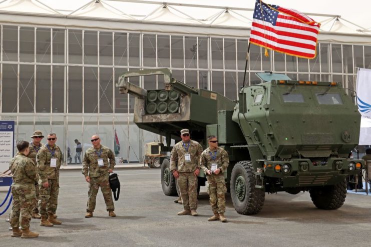 US soldiers standing around an M142 HIMARS