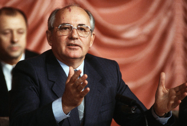 Mikhail Gorbachev sitting at a table