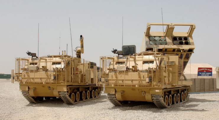 Two M270 MLRS parked outside