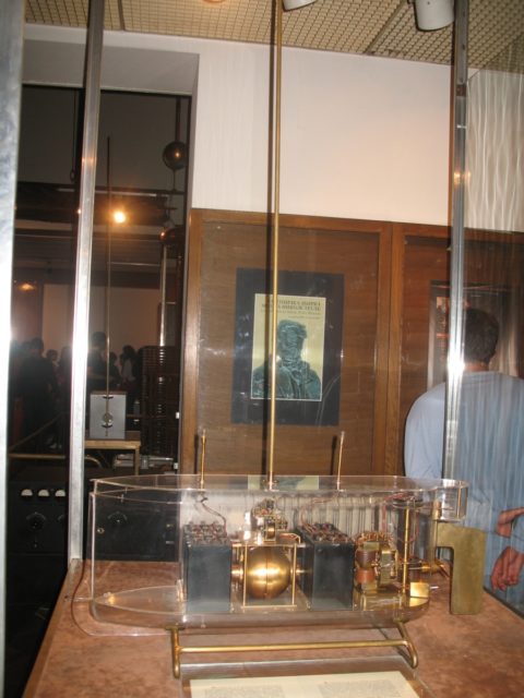 Model of Nikola Tesla's radio-controlled boat within a glass case