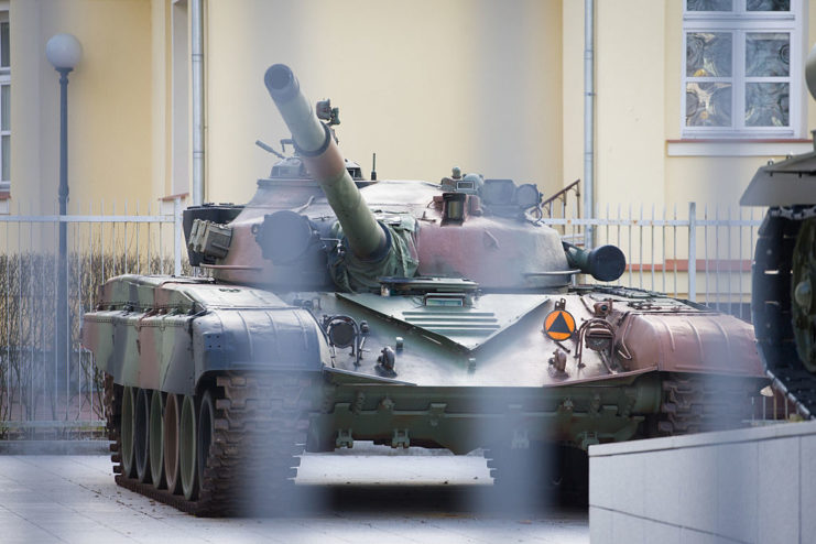 T-72 tank parked behind a fence