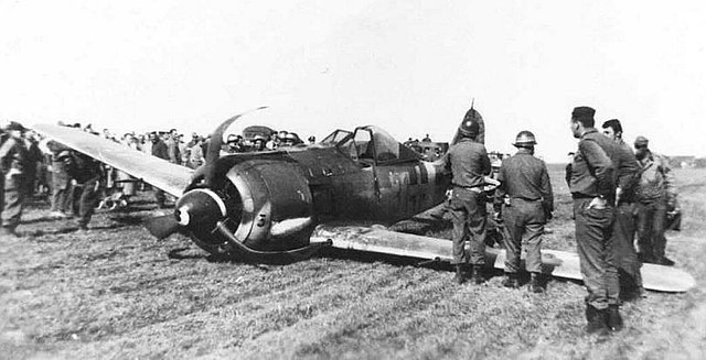Allied military personnel standing around a Focke-Wulf Fw 190