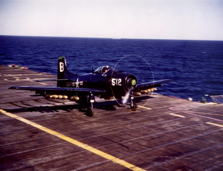 A blue Douglas AD-4 Skyraider taking off from a aircraft carrier during the Korean War