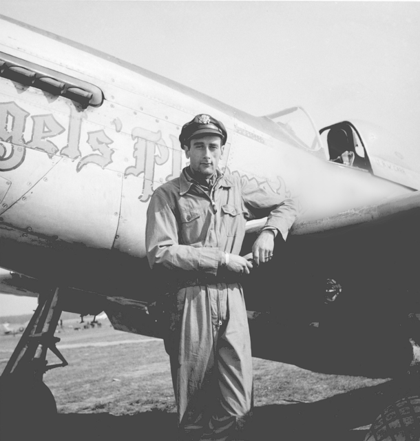 Bruce Carr standing in front of his North American P-51D Mustang "Angels' Playmate"