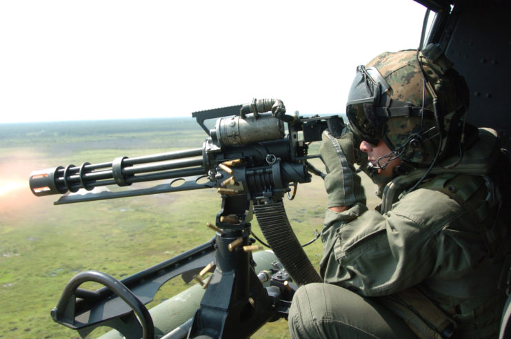 Sgt. Early M. Day firing the GAU-17 weapons system from a Bell UH-1N Twin Iroquois