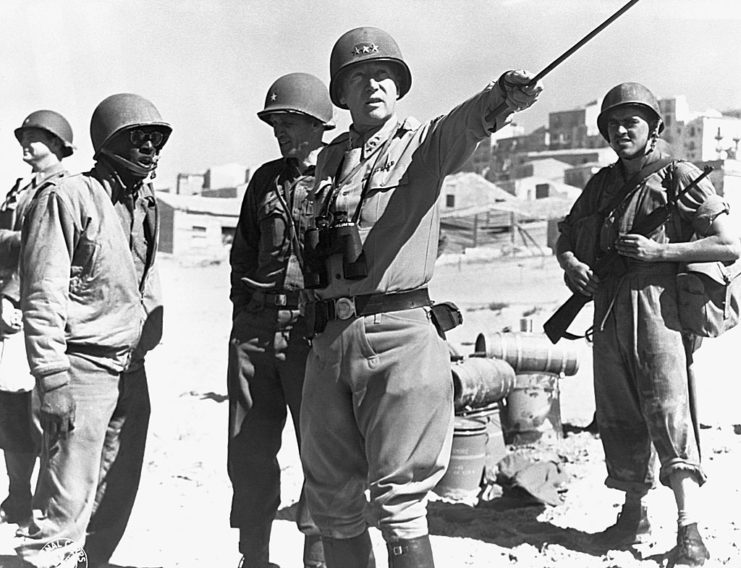 George Patton standing with American troops