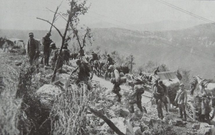 Italian infantrymen climbing up a rocky peak