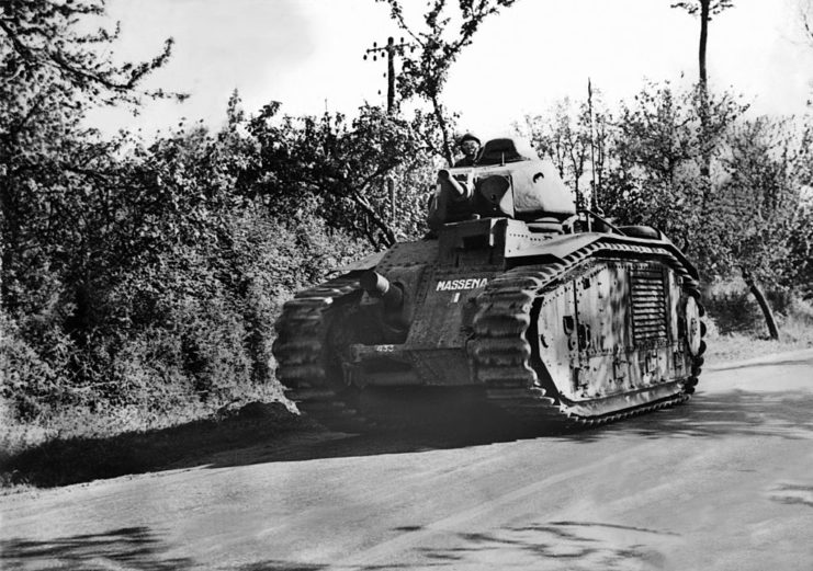 Char B1 tank driving down a road