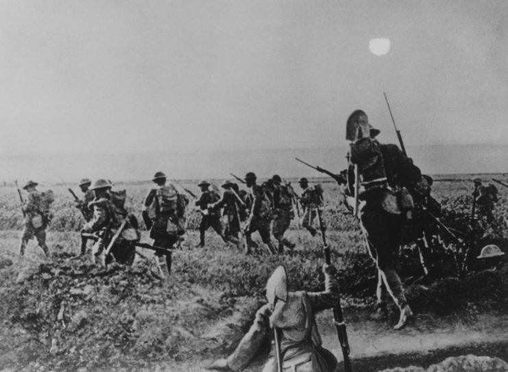 US troops running forward in a group during the Battle of Cantigny