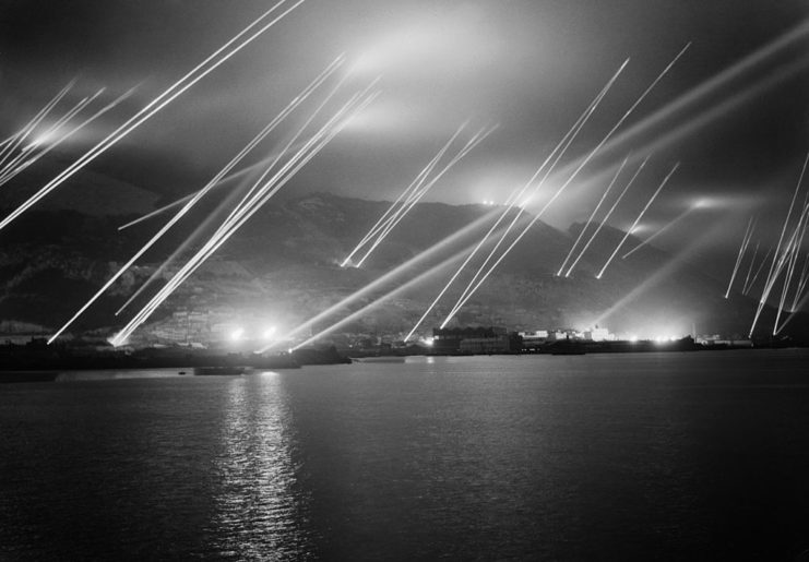Searchlights being lit along the coast of Gibraltar