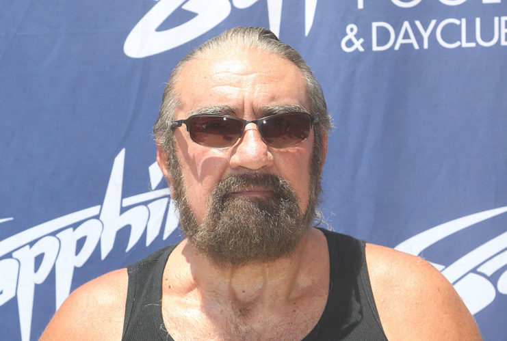 Richard Marcinko wearing a tank top and sunglasses