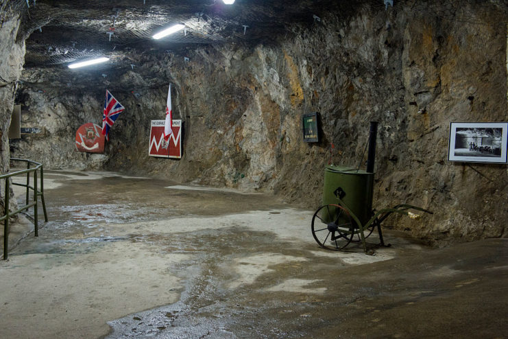 Rock tunnel with British artifacts attached to the walls