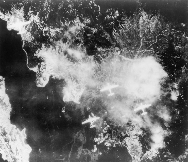 Four Boeing B-29 Superfortresses flying over Japan