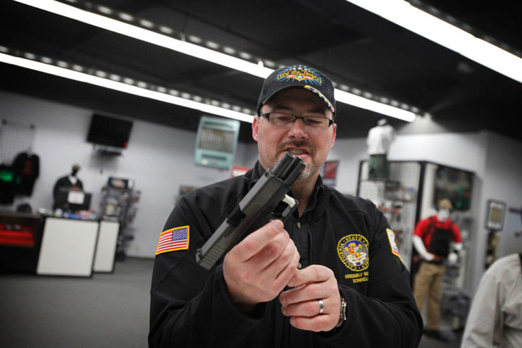 Law enforcement officer holding a Glock 19