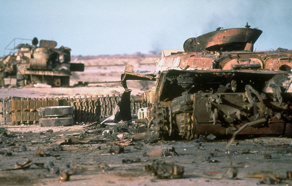 Two destroyed Iraqi tanks in the desert