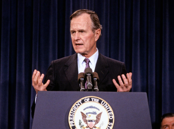 George H.W. Bush speaking at a podium