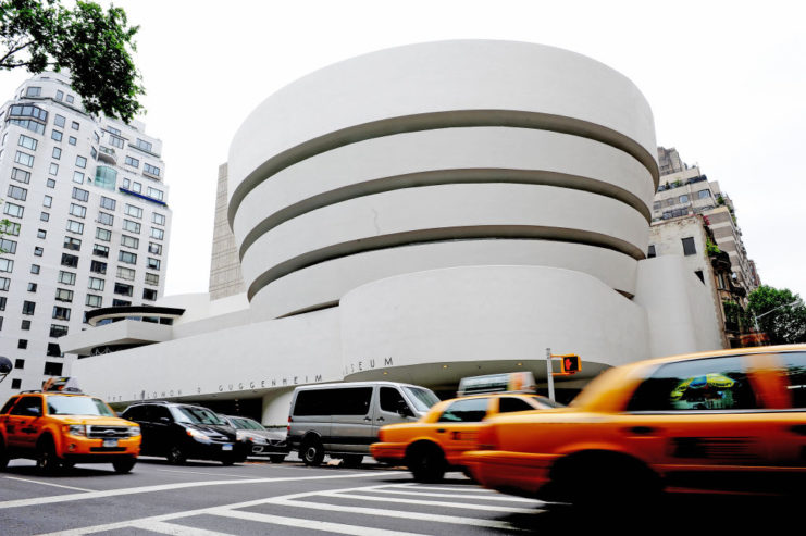 Taxis driving by the Guggenheim