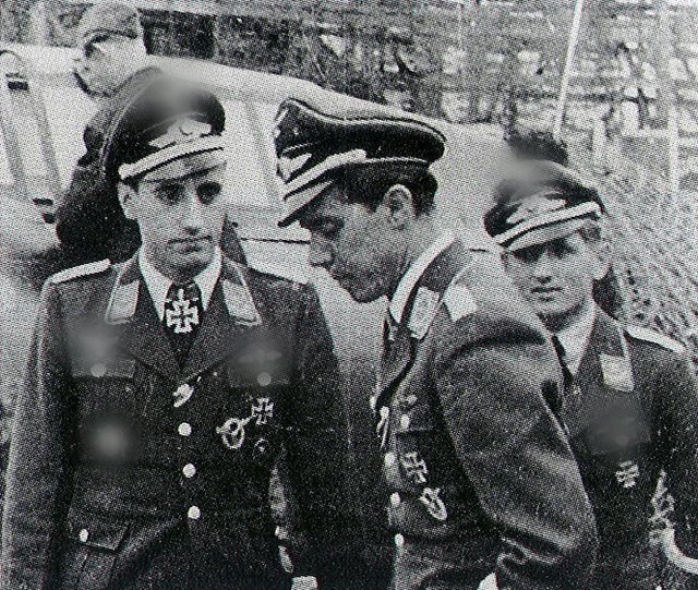 Heinz-Wolfgang Schnaufer standing with Hans-Joachim Jabs and another German military member