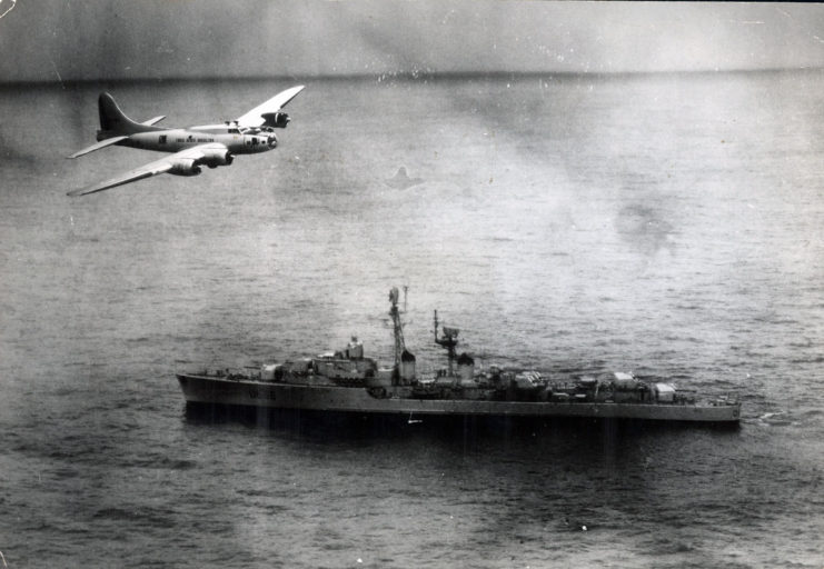 Boeing B-17 Flying Fortress flying over the French destroyer Tartu (D636)