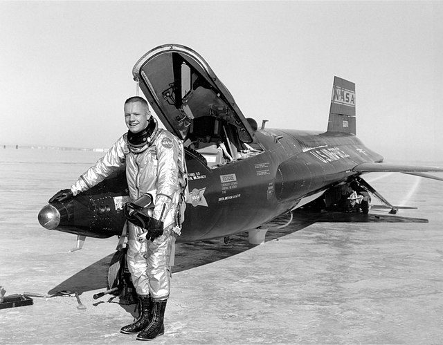 Neil Armstrong standing beside a North American X-15