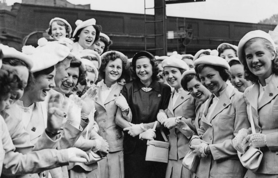 Odette Sansom standing with a group of young women