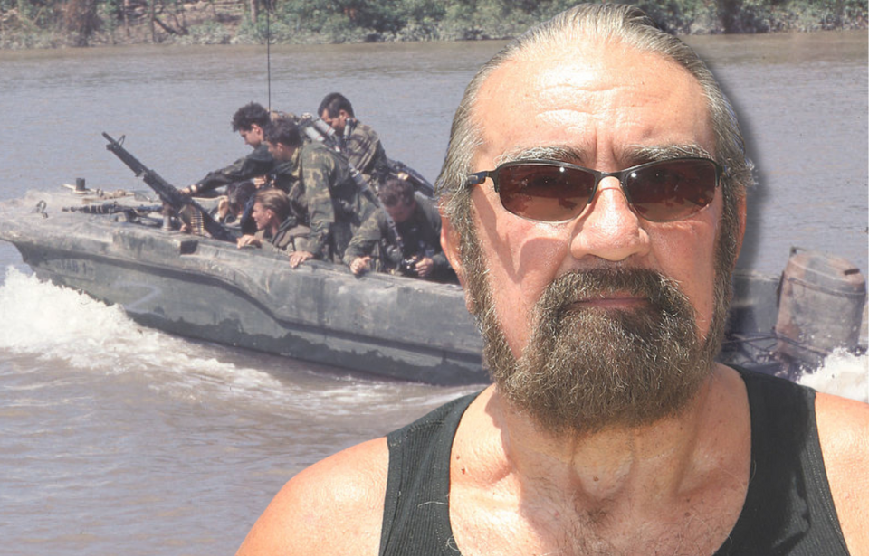 Members of US Navy SEAL Team One onboard an Assault Boat + Richard Marcinko wearing a tank top and sunglasses