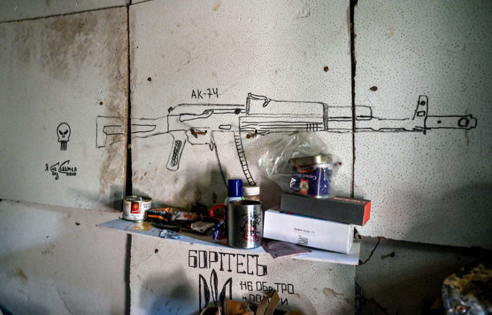 Drawing of an AK-47 on a wall