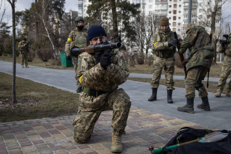 Territorial Defence Forces volunteer aiming a weapon