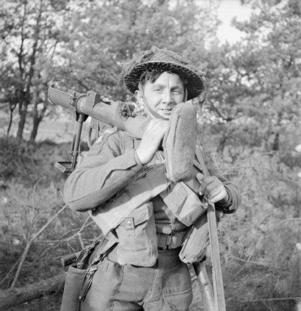 Soldier carrying a PIAT on his shoulder