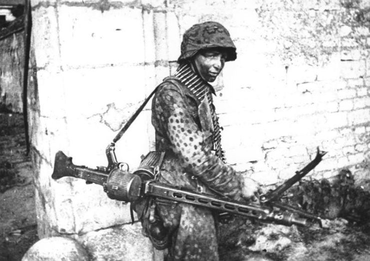 Waffen SS soldier standing with an MG-42 holstered on his shoulder