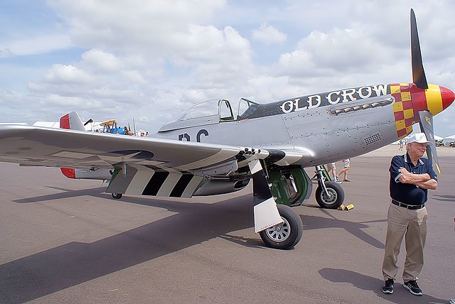 Clarence "Bud" Anderson standing in front of his North American P-51D Mustang 'Old Crow'