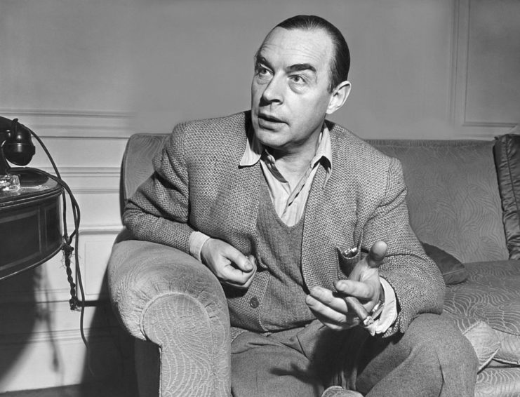 Erich Maria Remarque sitting on a couch