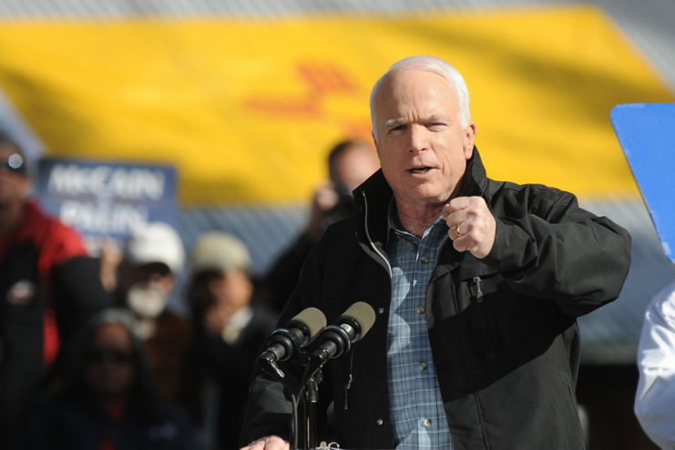 John McCain speaking at a podium