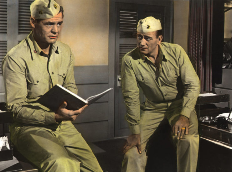 Robert Ryan and John Wayne as Capt. Carl "Griff" Griffin and Maj. Daniel Xavier Kirby