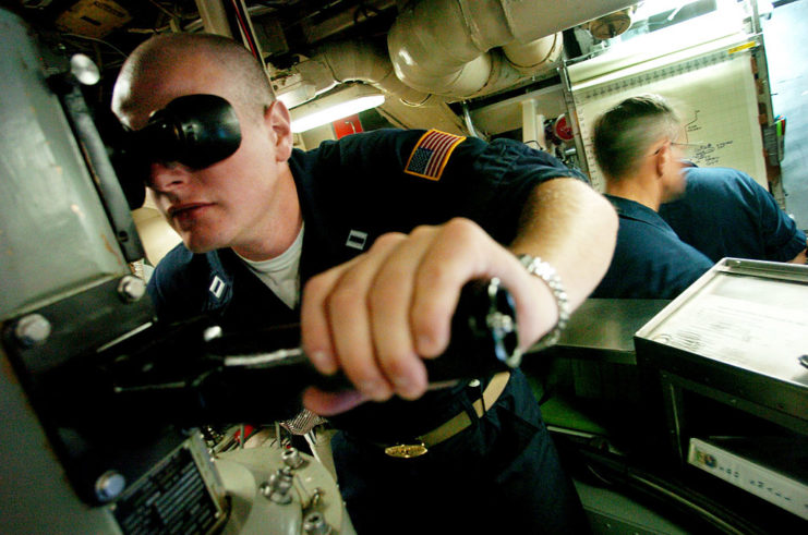 Lt. Alex Baerg looking through the USS Georgia's (SSGN-729) periscope
